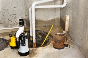 Replacing The Old Sump Pump In A Basement