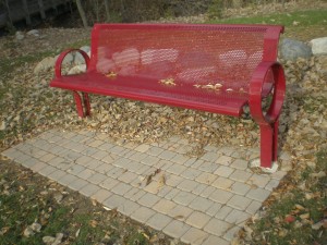 Park benches with brick pavers.