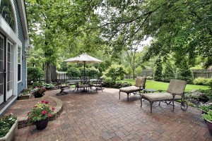 Brick patio with table umbrella and chairs