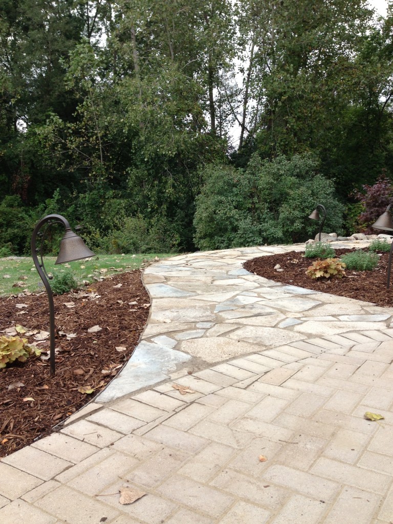 Curved pathway off paver driveway