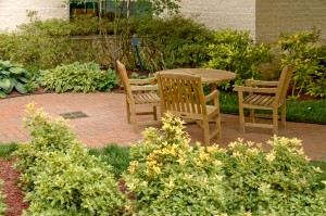Outdoor patio with wooded furniture and plants