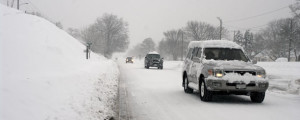 cars driving on snowy roads.