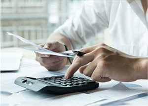 Man calculating the cost of a landscape project.