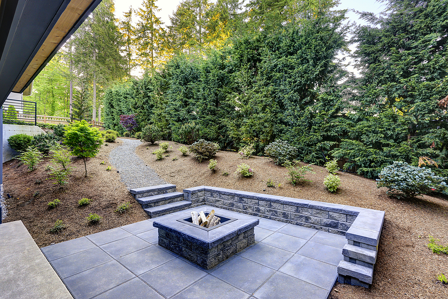Nice modern fire pit with landscape paver surround.