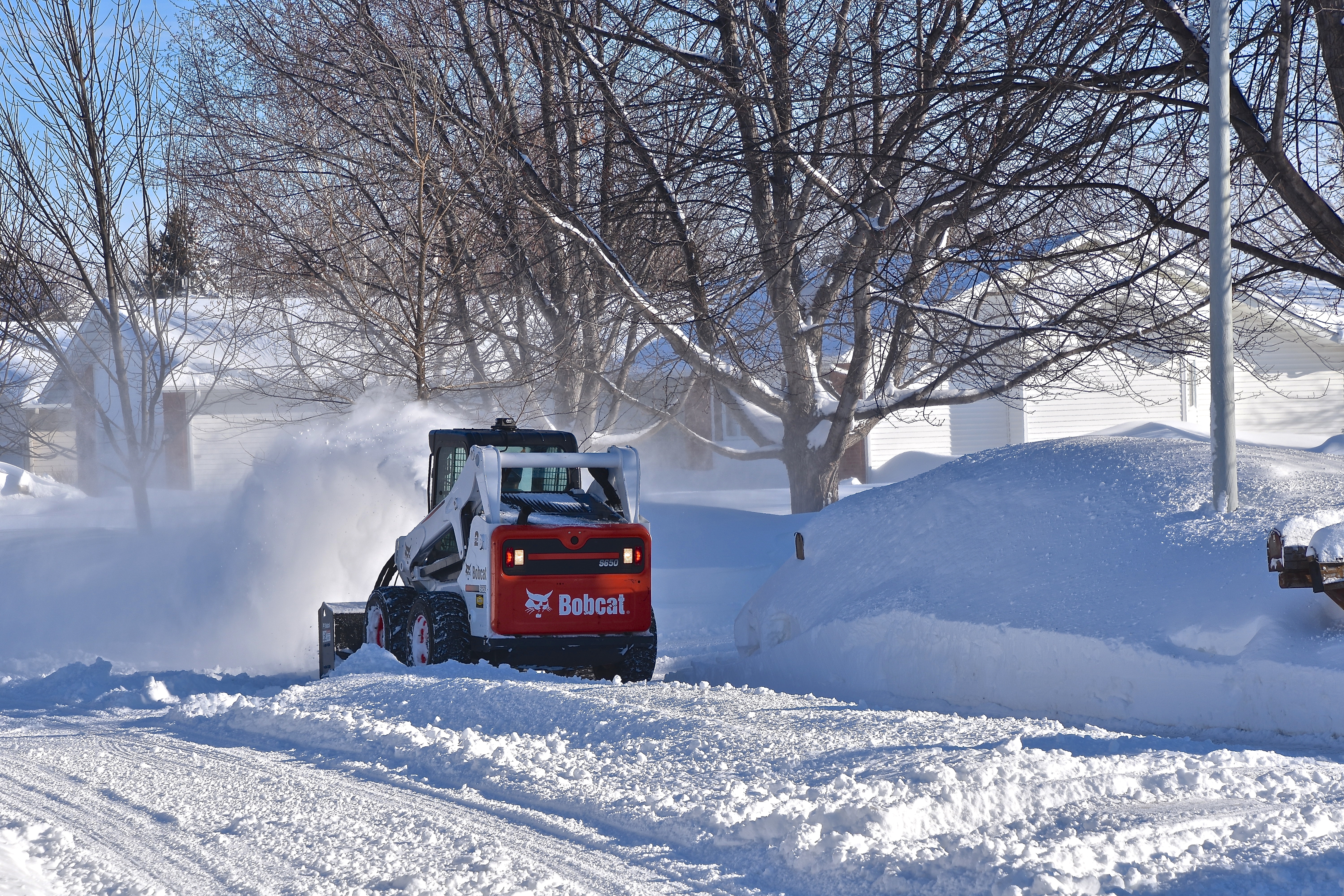 Snow removal after a winter storm in an HOA neighborhood.