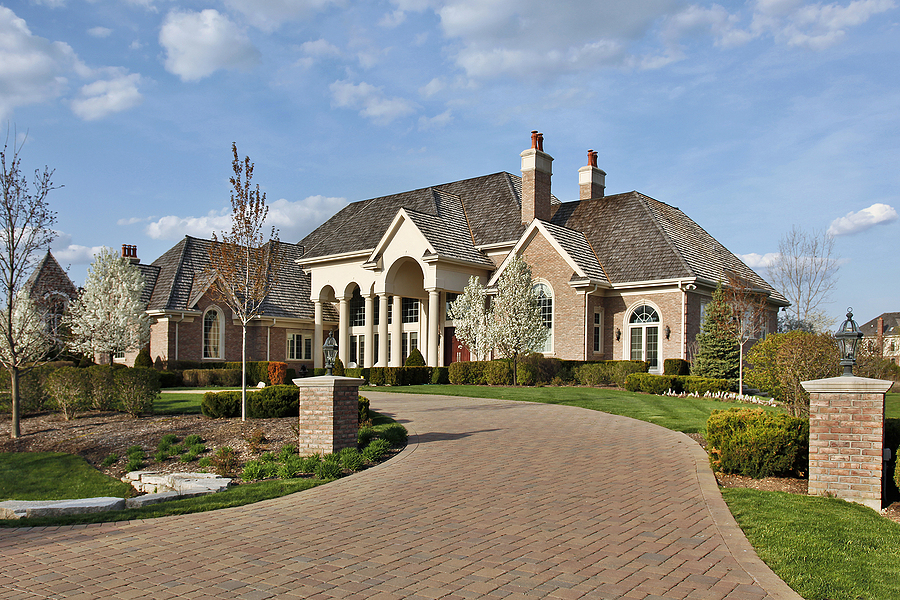 Luxury home with beautiful patio paver driveway.