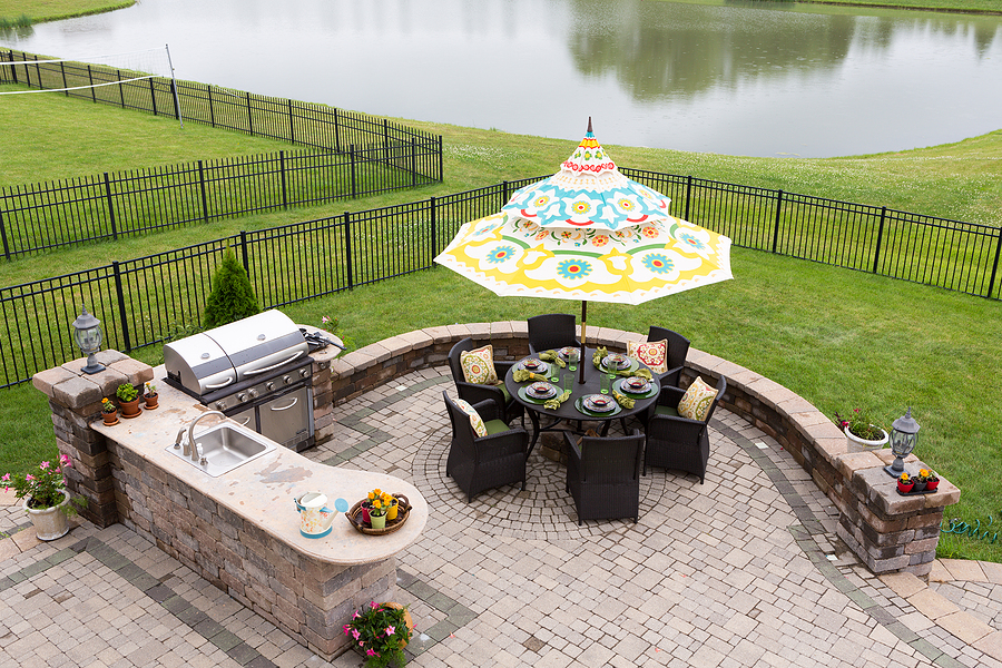 Beautiful outdoor living space with outdoor kitchen and dining areas.