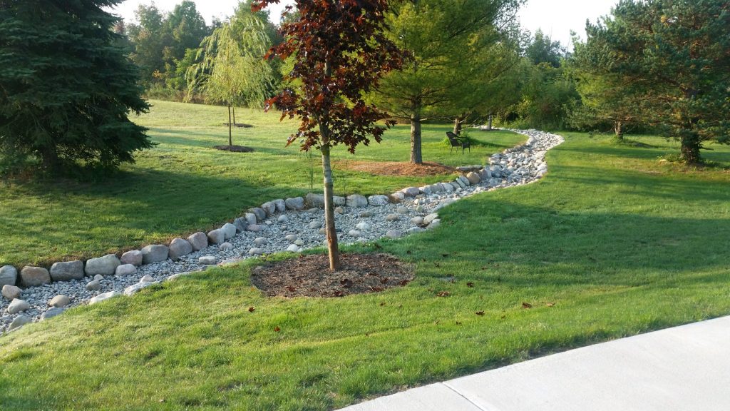 dry creek bed installed by twin oaks landscape in ann arbor michigan