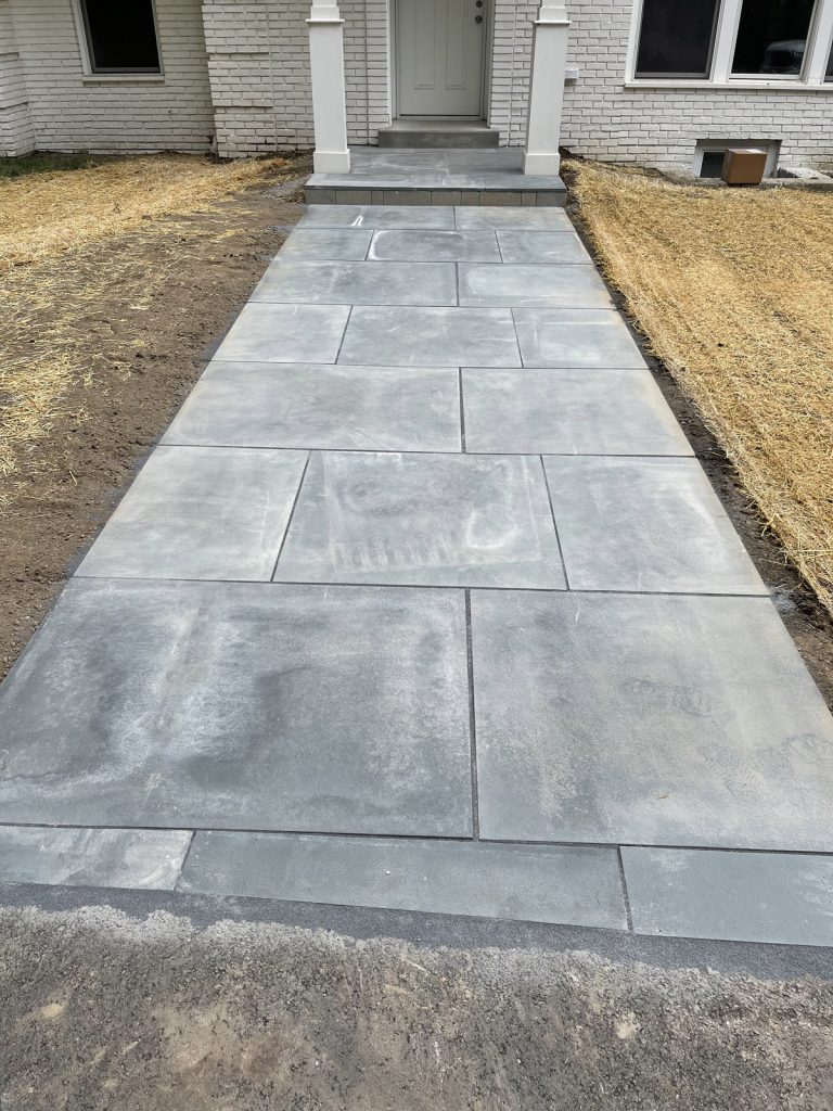 short paver walkway from hardscape porch