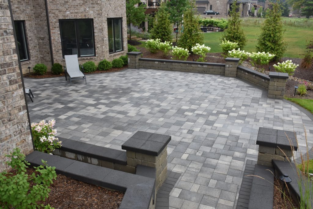 Multicolored gray paver patio in a circle shape in Ann Arbor