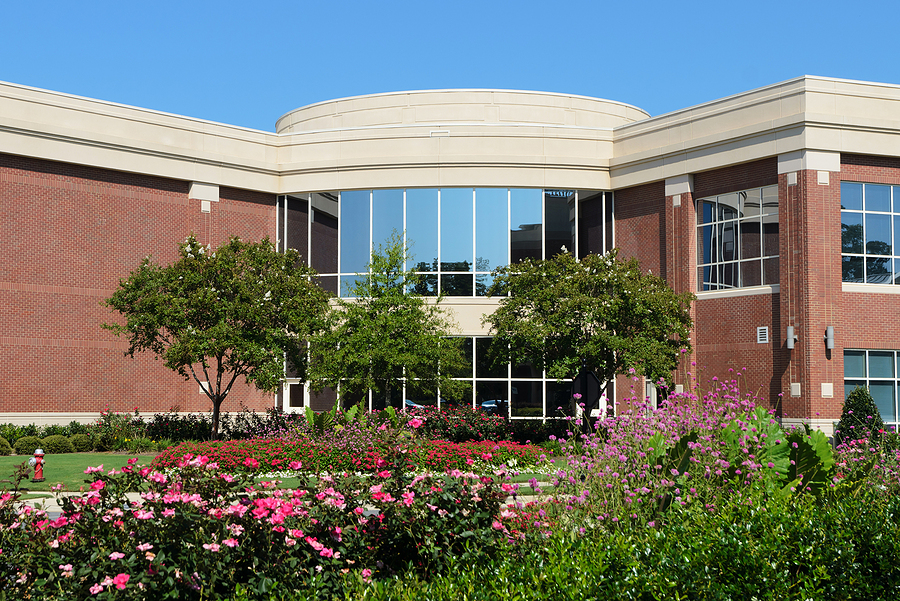 Office building front with beautiful landscaping in front