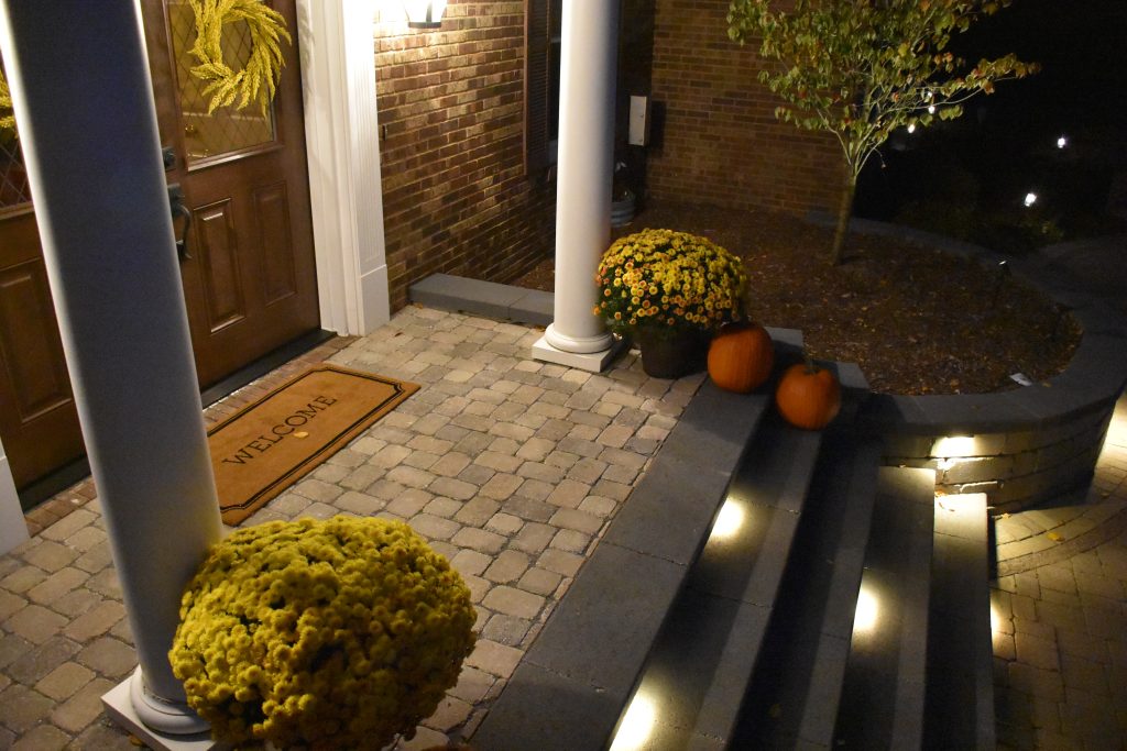Front porch area of a home showcasing the landscape lighting