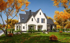 Luxury home in Autumn with blue sky and leaves turning color on the trees.